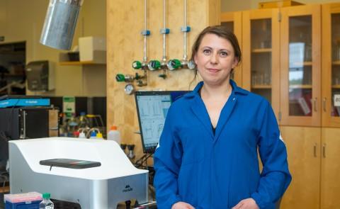 Eva Balog poses for a portrait in her lab